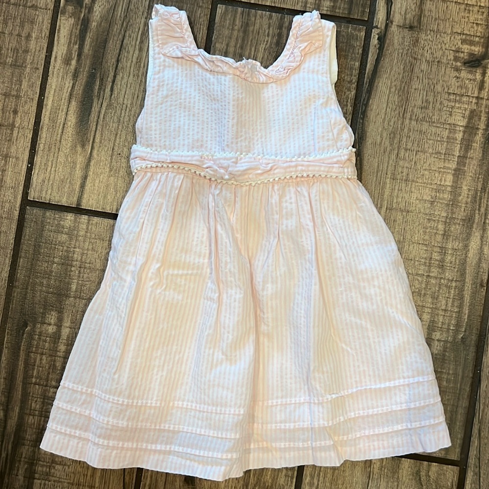 White and pink seersucker dress with bow tie in the back.